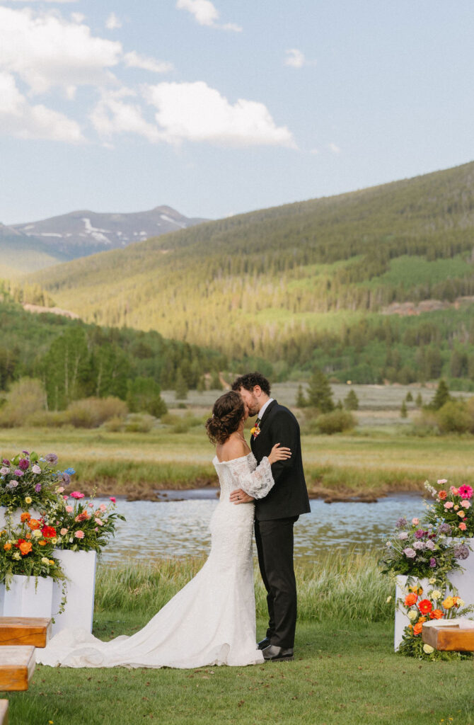 camp hale wedding ceremony with mountain and lake views