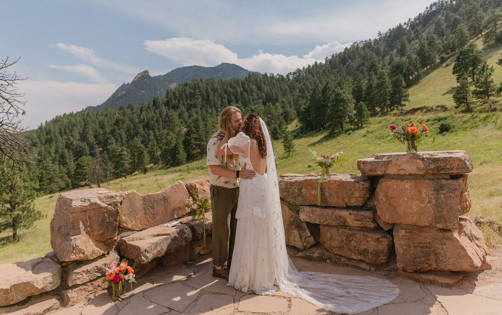 Halfway House Boulder Wedding Venue First Kiss at Mountain Ceremony