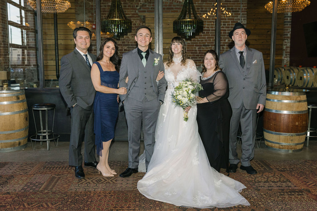 Indoor wedding family portrait at a chic, vintage venue in Denver.