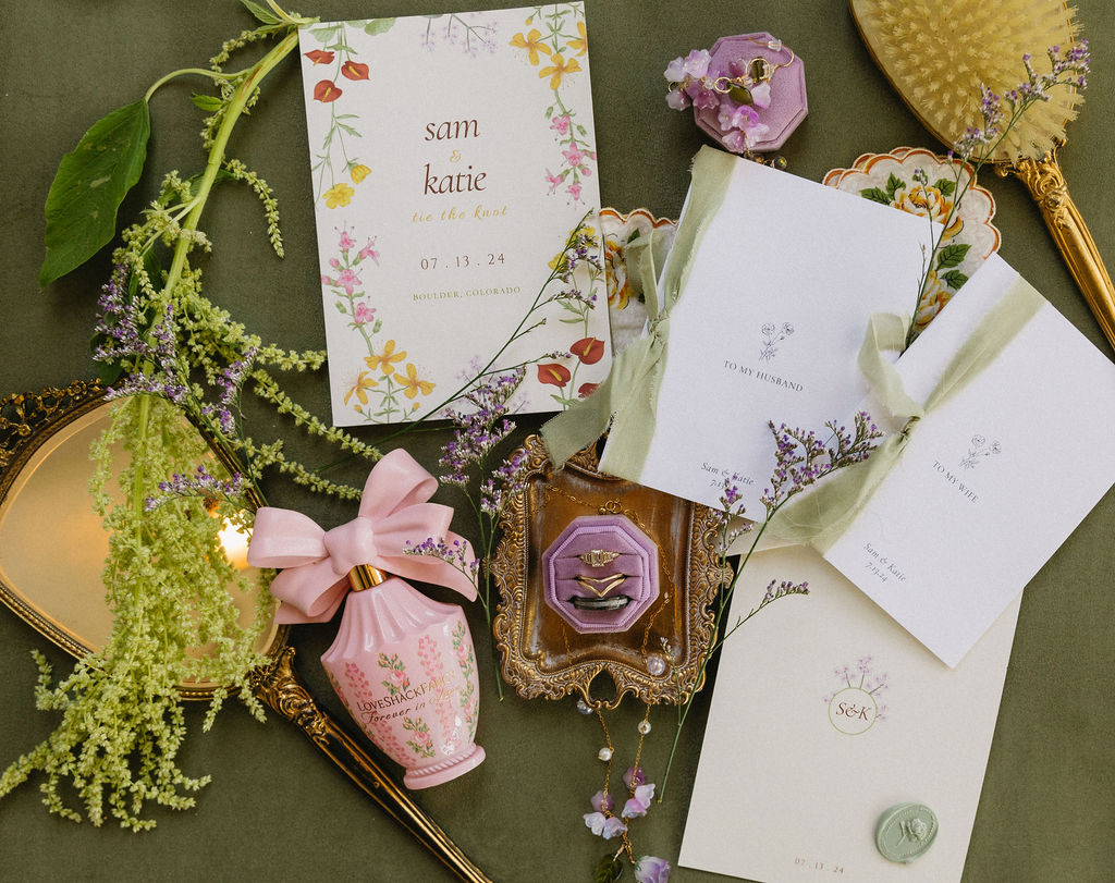 Colorful wildflower inspired summer wedding invitation suite and flat lay details from a Colorado wedding.