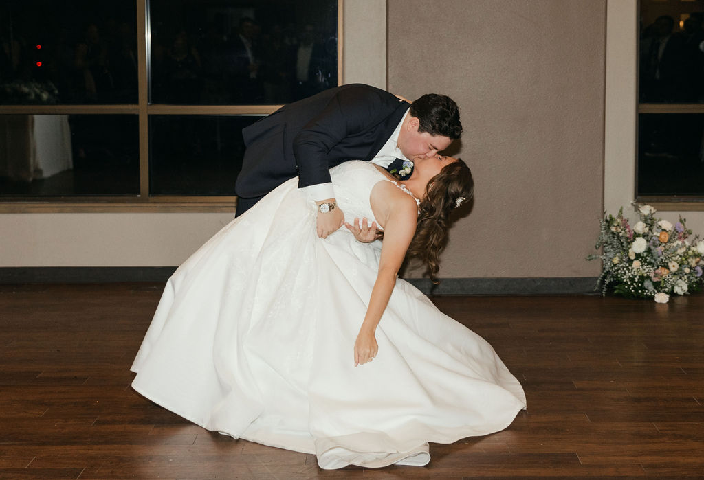 bride and groom dip kiss