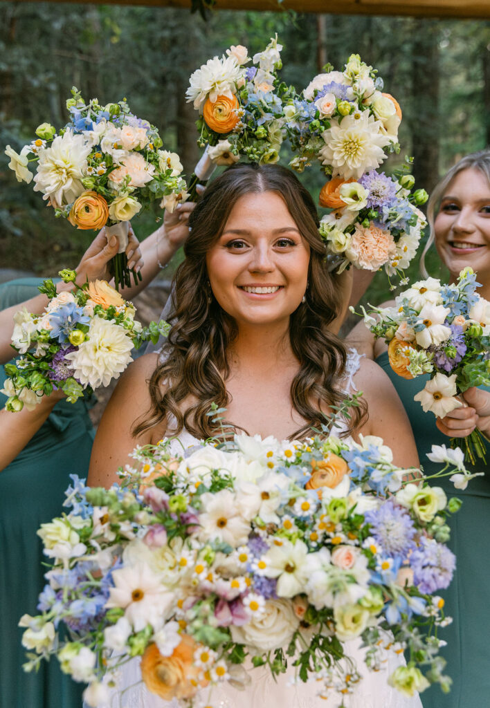 bride surrounded by bridesmaid bouquet frame