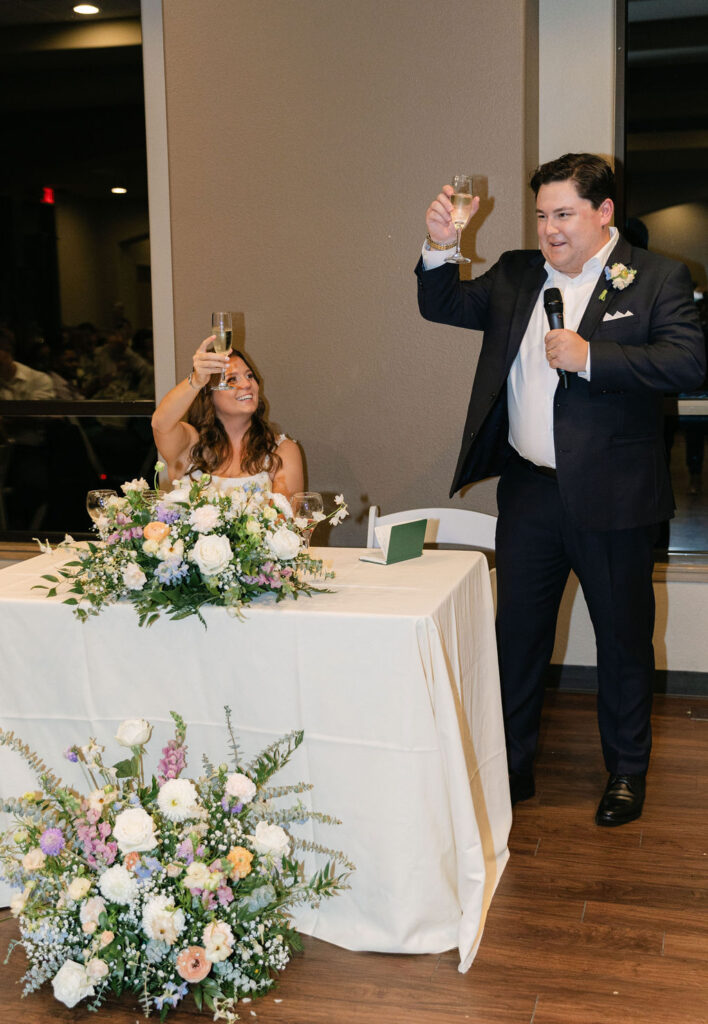 candid bride and groom reception toast moments