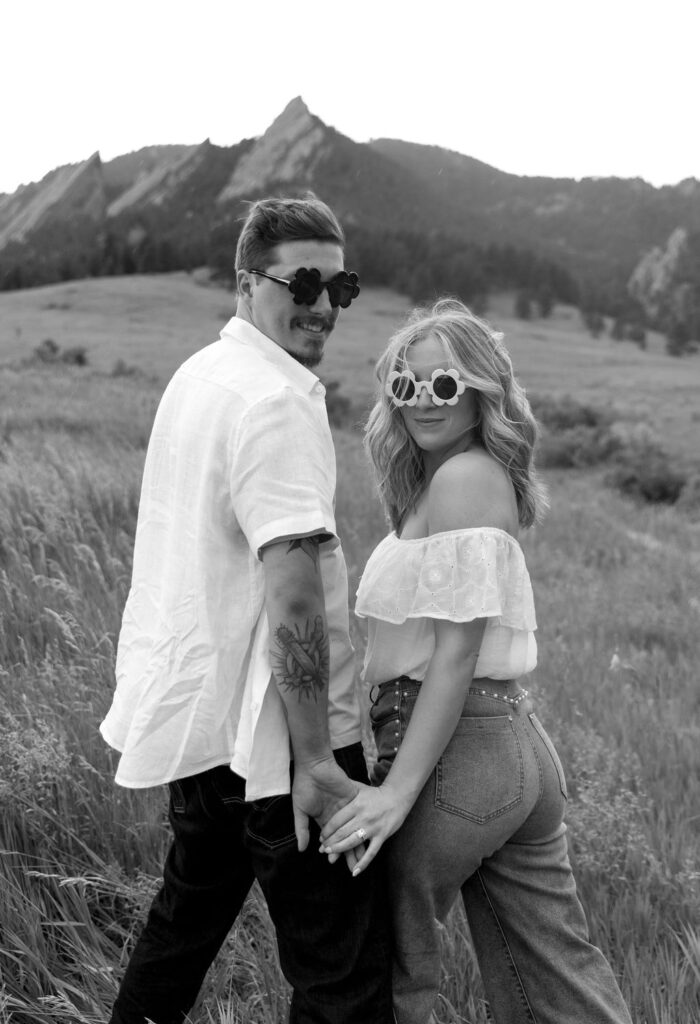 Hipster engagement session at Chautauqua Park in Boulder with floral sunglasses