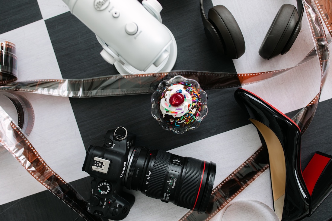 Details of a sundae, camera, microphone, and 35mm film from a wedding photography podcast, the sundae best.