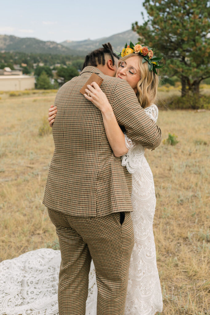 emotional bride and groom first look during their estes park elopement at knoll-willows open space