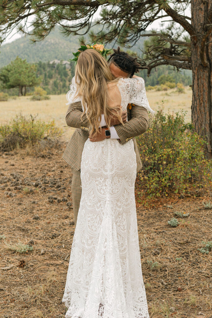 emotional bride and groom first look during their estes park elopement at knoll-willows open space