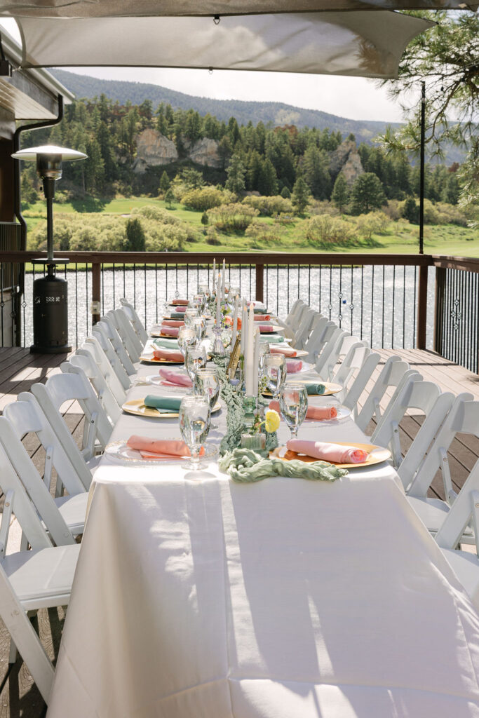 elegant lakefront reception table with mountain views in Colorado