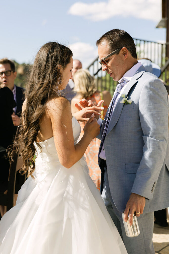 Candid moment between bride and dad during the outdoor cocktail hour