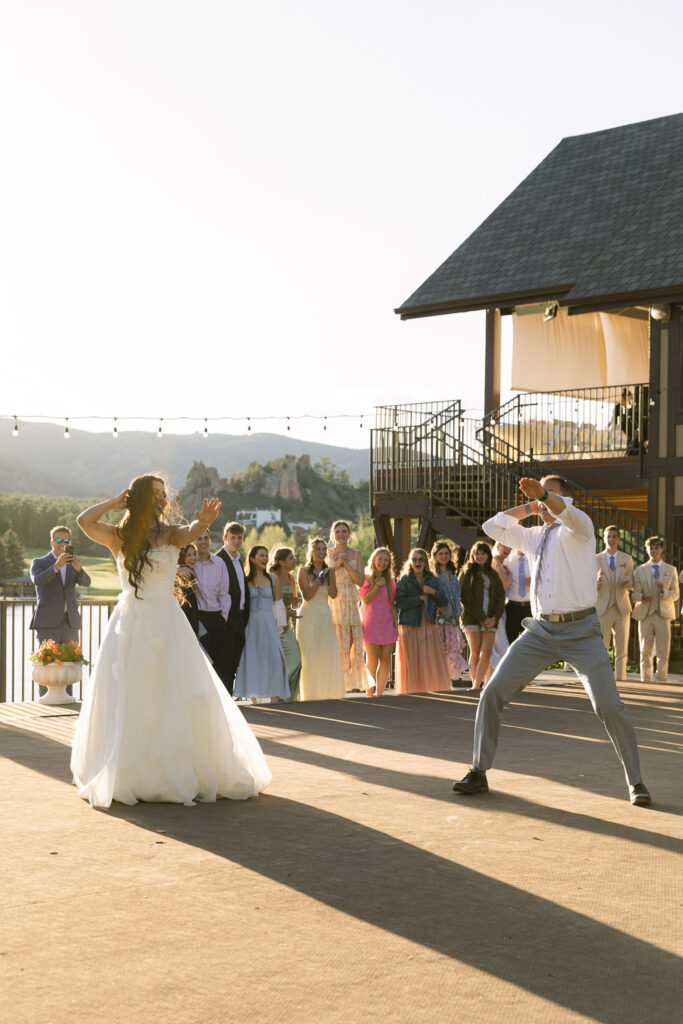 Candid bride and father dance