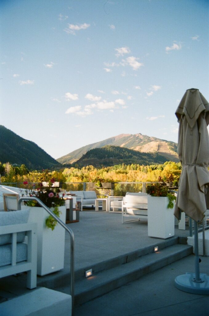 Mountain views from a modern rooftop patio in Aspen, Colorado—an ideal setting for intimate weddings or cocktail hours at top Aspen wedding venues.