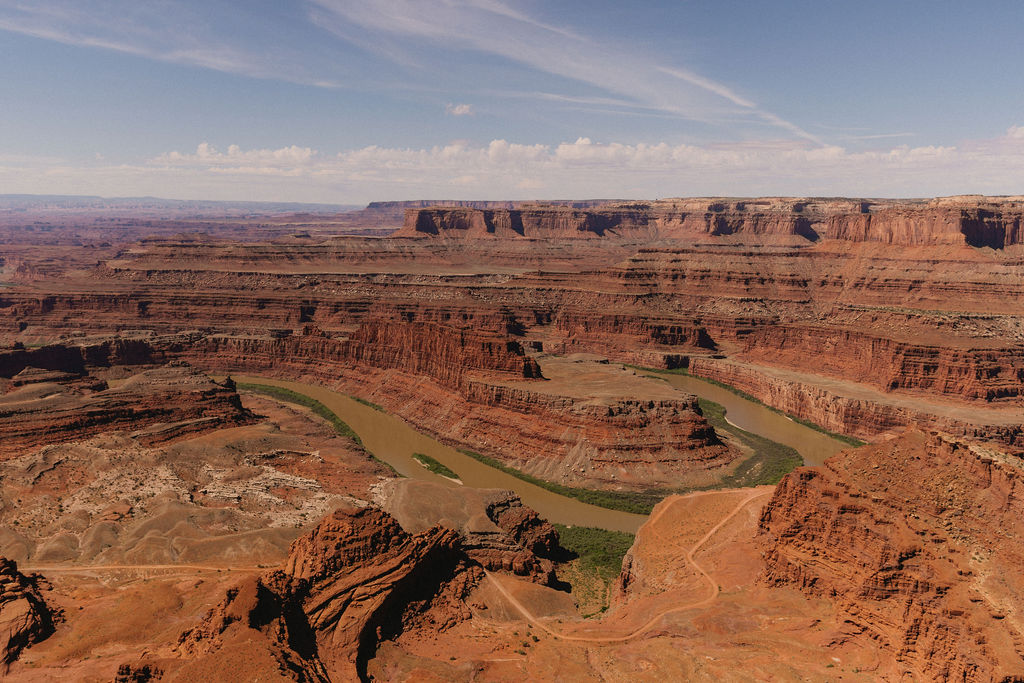 Rock formations and mesas in the warm desert sun at Dead Horse Point State Park, just a short drive from many private and public Moab wedding venues.