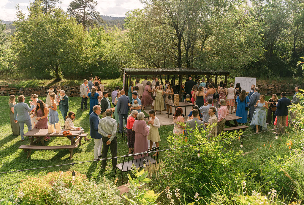 cocktail hour at stone mountain lodge, a garden wedding venue in Colorado