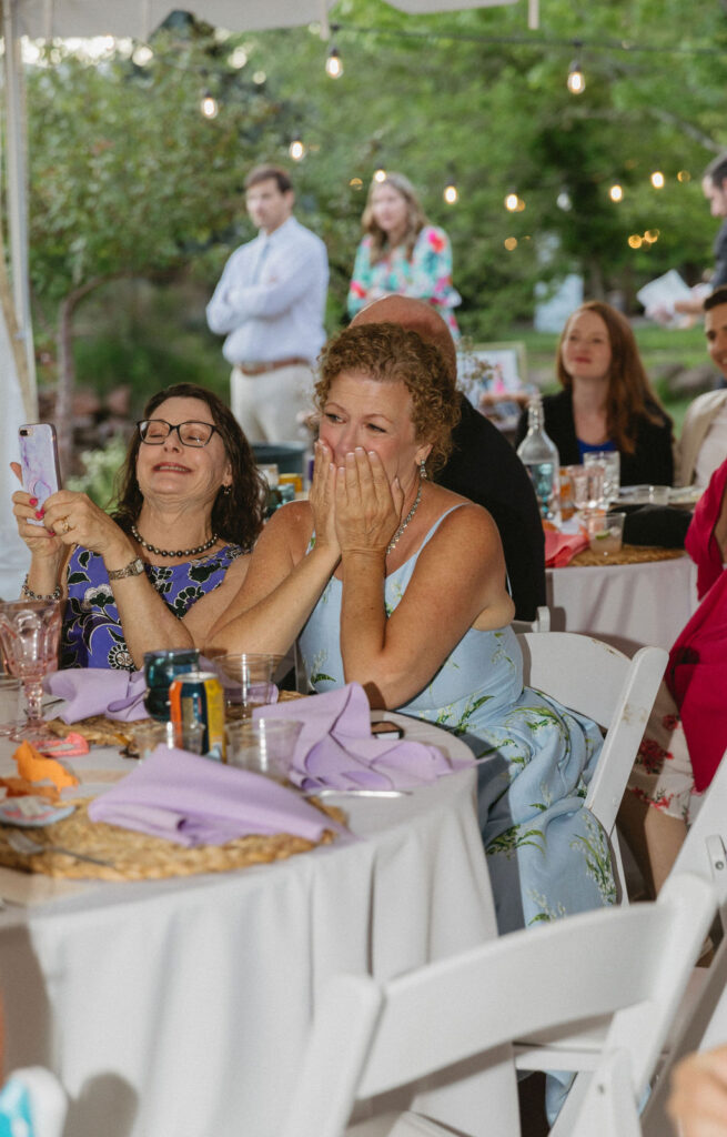 candid wedding reception moment at stone mountain lodge
