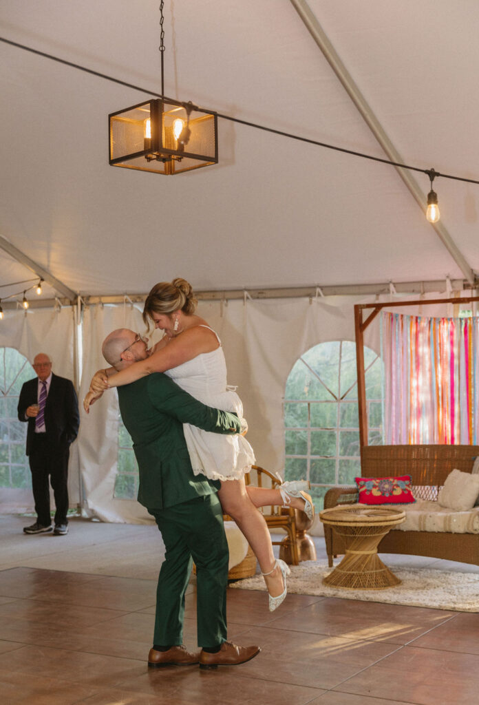 candid wedding reception moment at stone mountain lodge