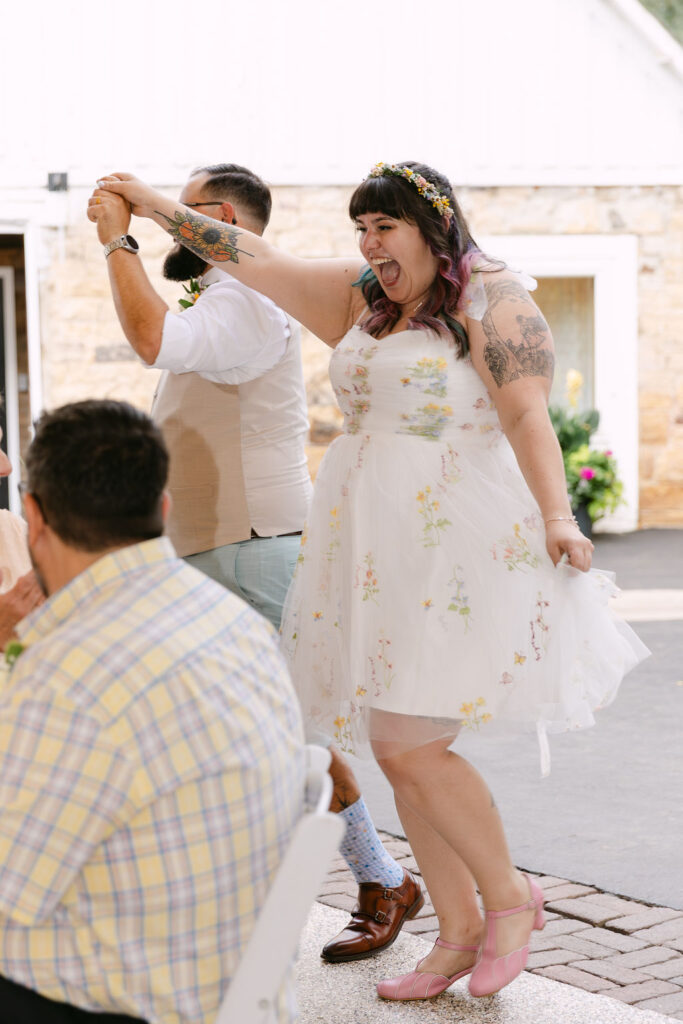 joyful bride and groom reception entrance