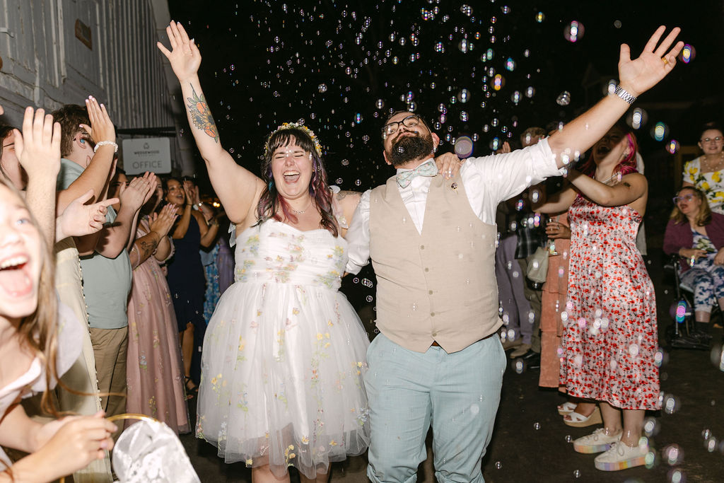 joyful and candid bride and groom wedding exit