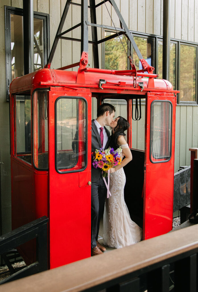bride and groom inside a Estes park aerial tram