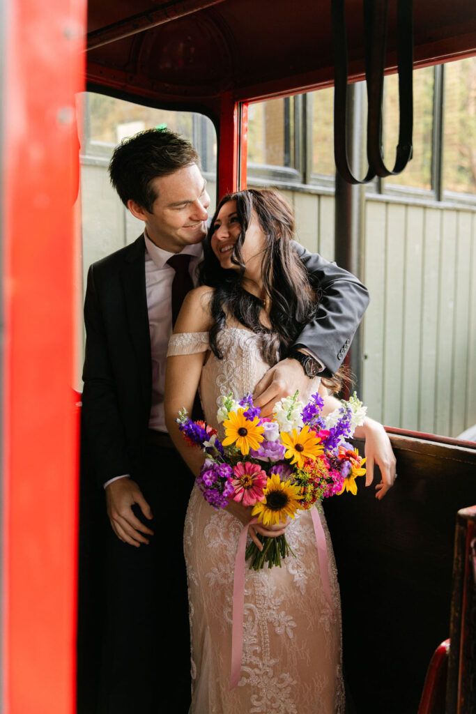 romantic bride and groom inside a Estes park aerial tram