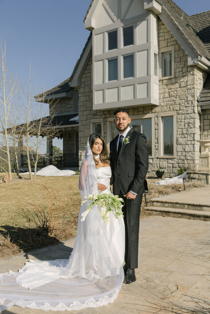 bride and groom in front of the greystone castle wedding venue