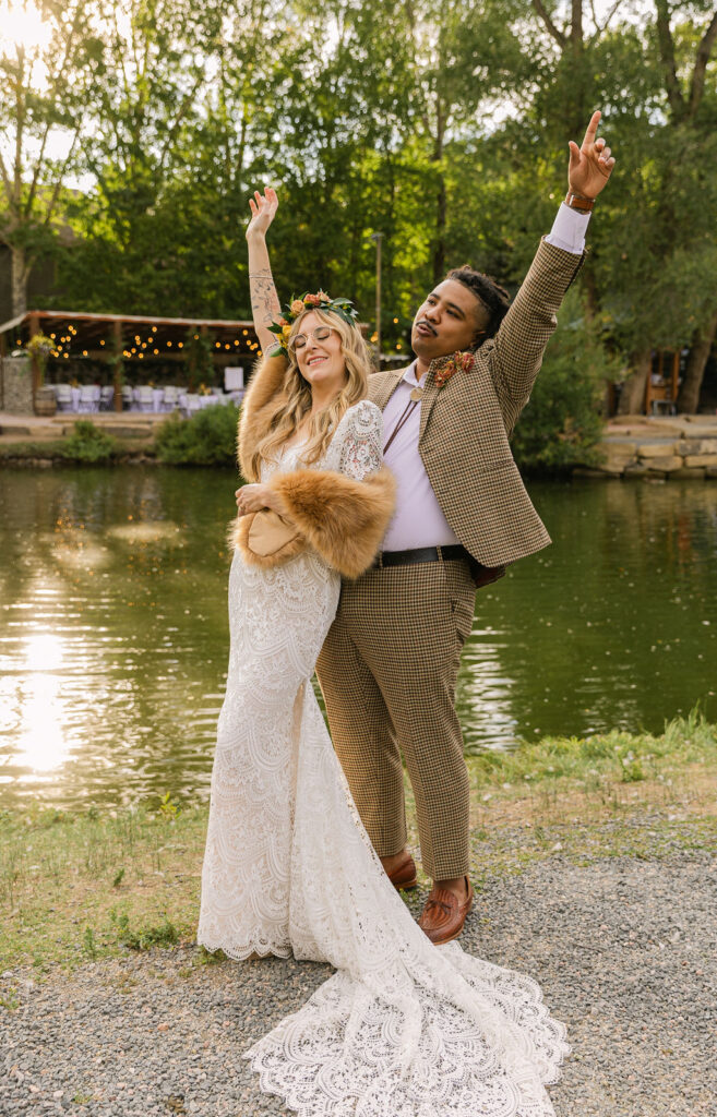 happy bride and groom during their wedding day at the venue on the rocks