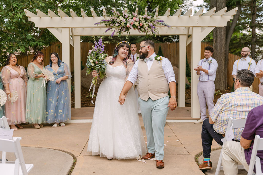 joyful bride and groom wedding ceremony exit
