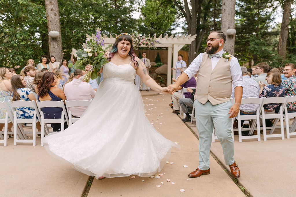 joyful bride and groom wedding ceremony exit
