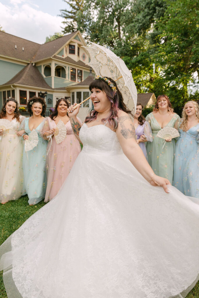 candid bride and bridesmaids, bridesmaids wearing pastel mismatched dresses