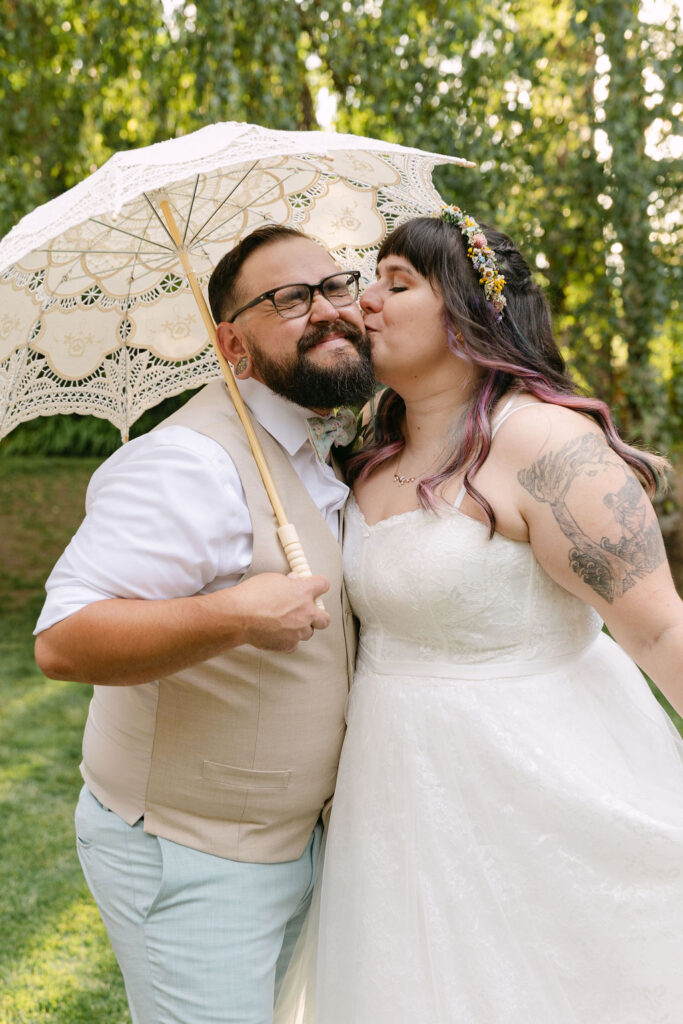 joyful bride and groom roaming around the grounds of the tapestry house by wedgewood weddings