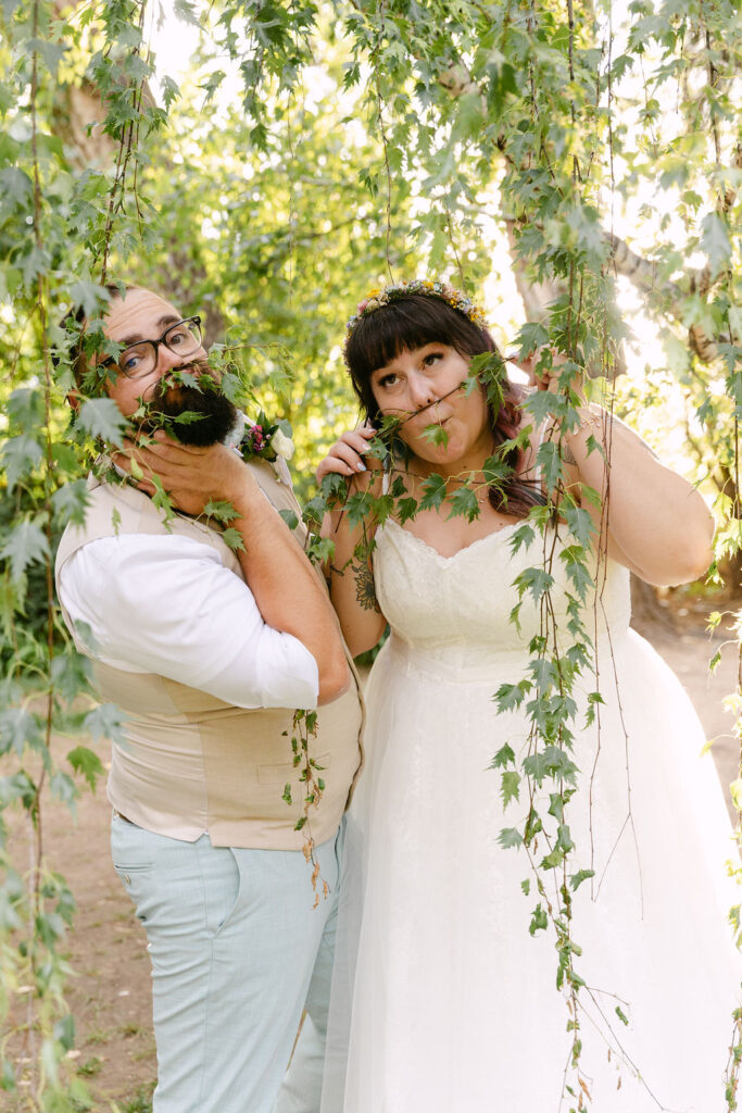 joyful bride and groom roaming around the grounds of the tapestry house by wedgewood weddings