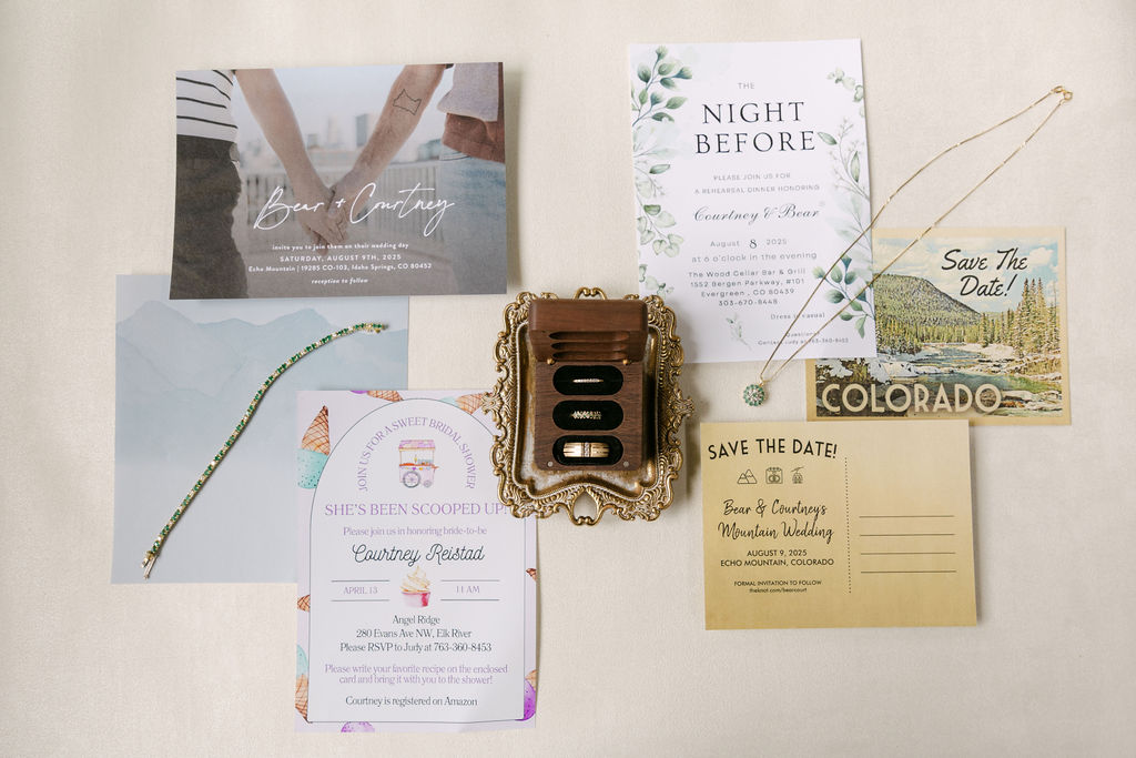 Wedding rings and invitation suite for a luxury mountain wedding at Echo Mountain in Colorado 