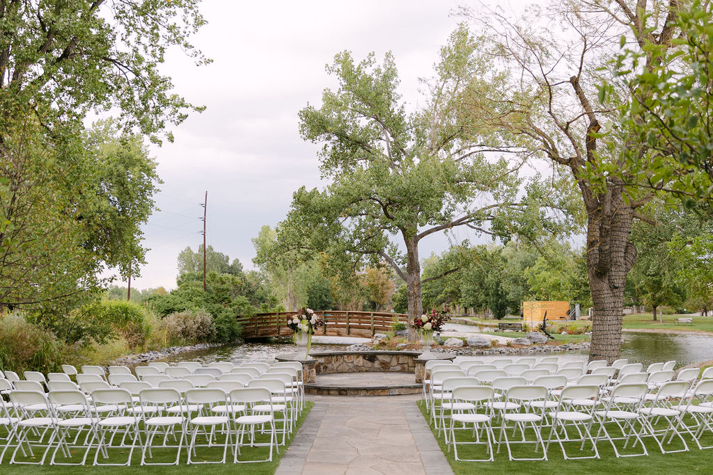 Empty ceremony space of Monet's Garden at Hudson Gardens before guests arrive for a Colorado outdoor garden wedding.
