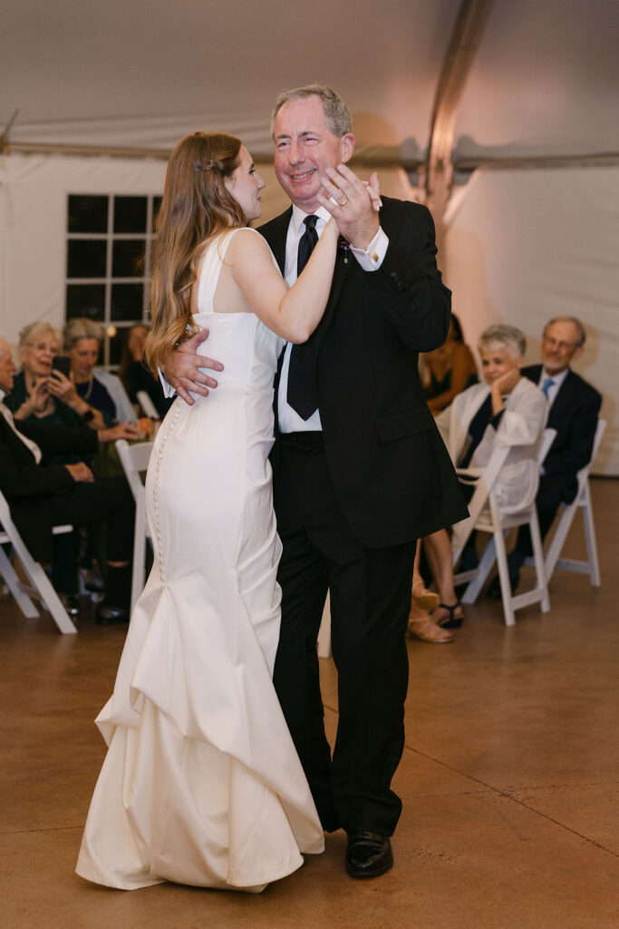 Bride dancing with her father during a luxury Colorado wedding reception.