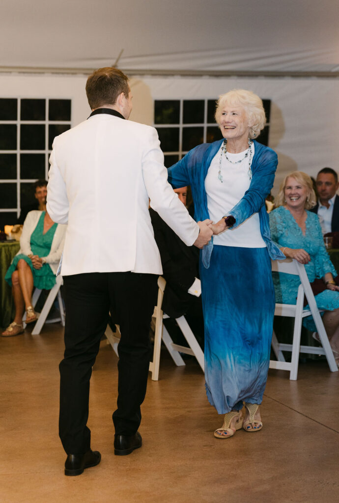 Groom dancing with his mom during a heartwarming moment at Hudson Gardens.