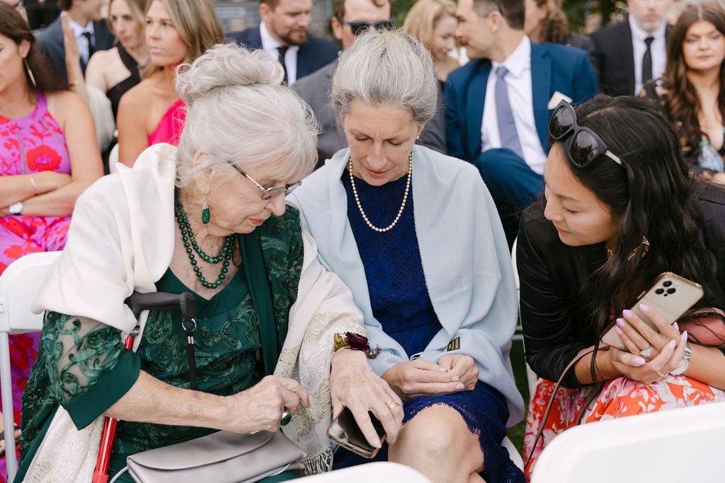 Wedding guests seated as the ceremony begins at Hudson Gardens, a Colorado garden wedding venue.