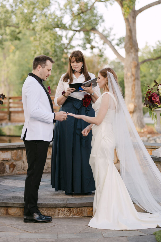 Bride and groom during vows in natural outdoor light at Hudson Gardens, captured in a fine-art wedding style.