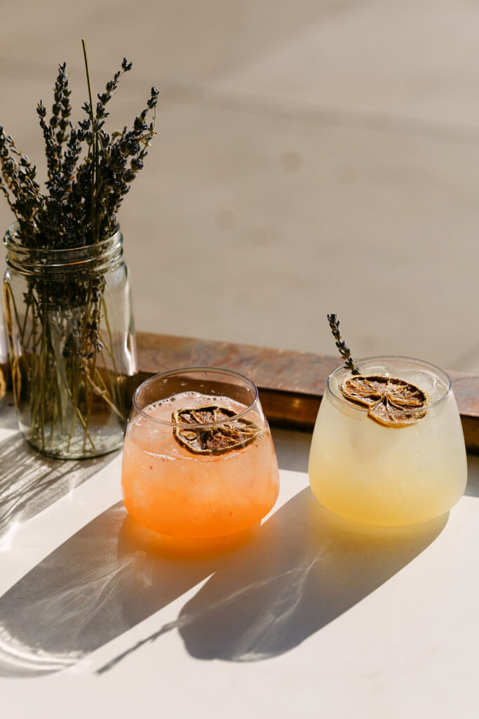 Gorgeous cocktails glistening in the sunlight at a wedding cocktail hour at Oceana's Garden 