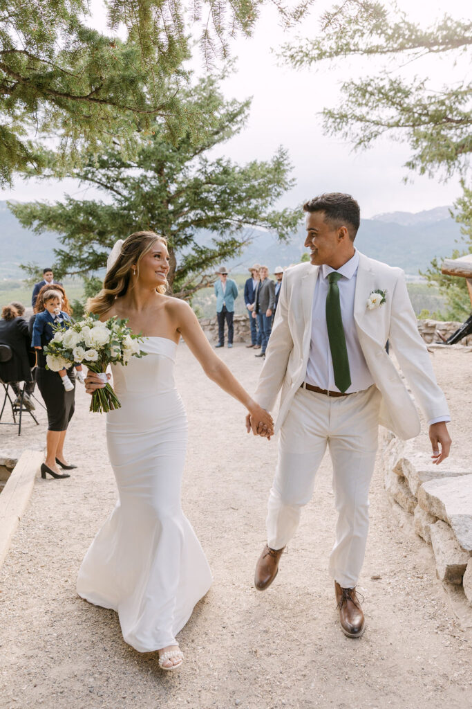 Bride and groom coming up the aisle after their wedding at Sapphire Point Overlook