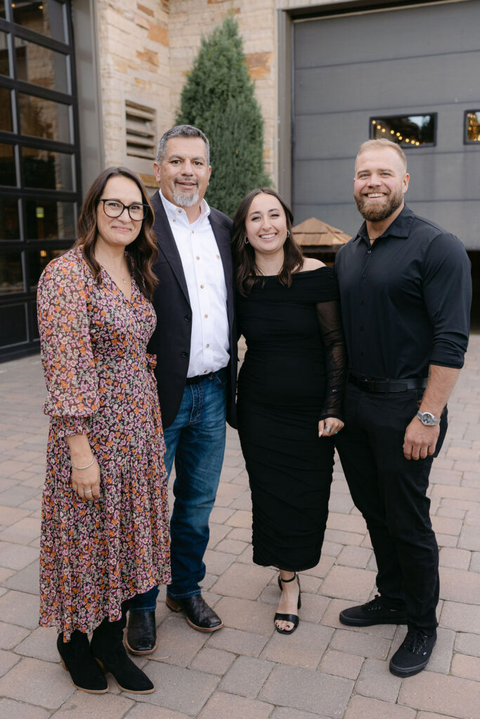 Group family portrait outside the lodge at Spruce Mountain Ranch.