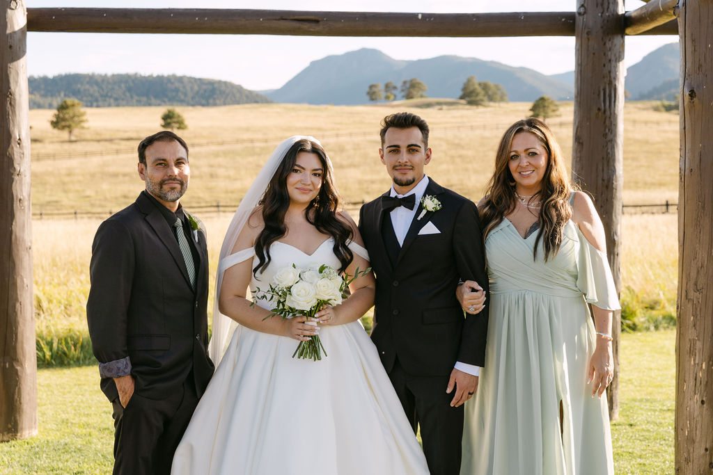 Family portraits with bride and groom at the ceremony site.