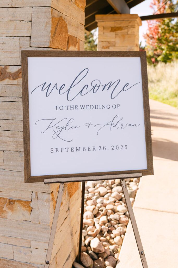 Elegant welcome sign displayed outside the ceremony pavilion at Spruce Mountain Ranch.