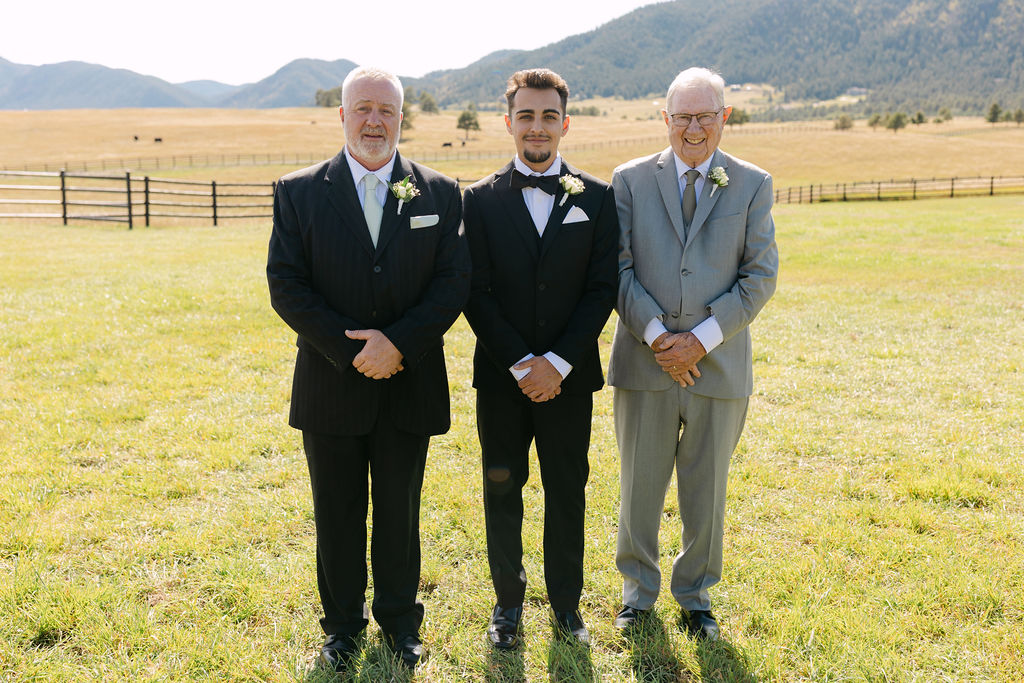 Three generations portrait of groom with father and grandfather at Spruce Mountain Ranch.