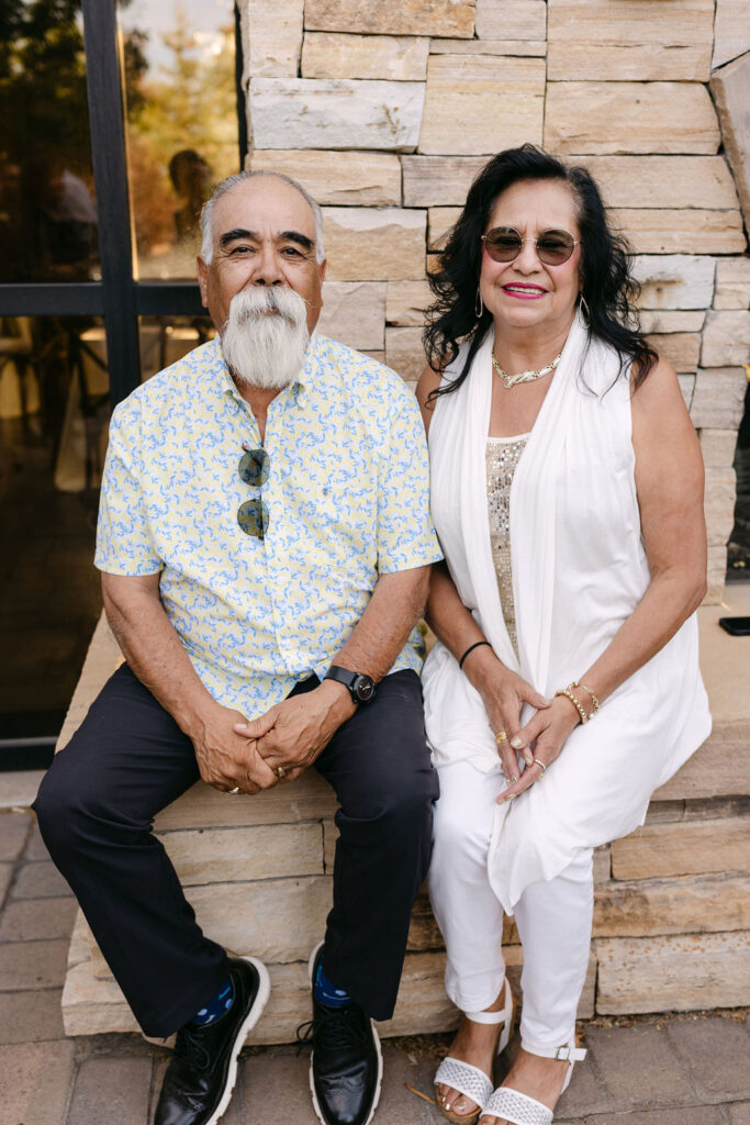 Guests sitting together outside the lodge at Spruce Mountain Ranch.