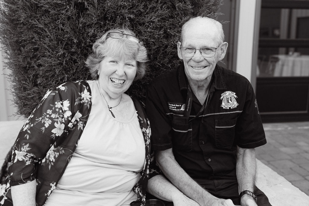 Grandparents smiling during cocktail hour at Spruce Mountain Ranch.