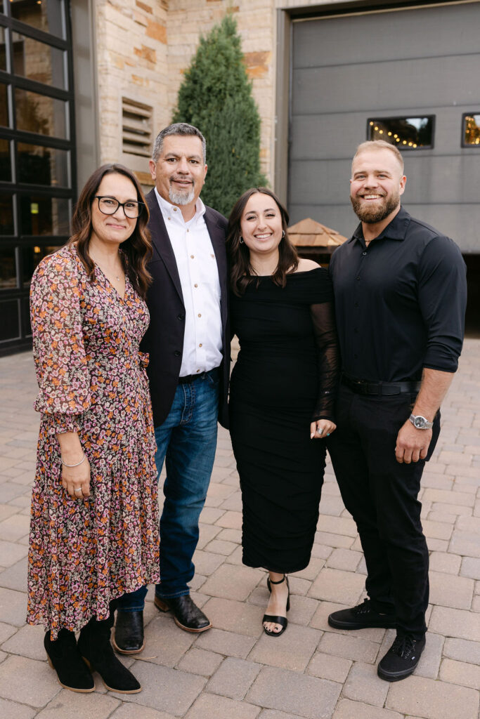 Group family portrait outside the lodge at Spruce Mountain Ranch.